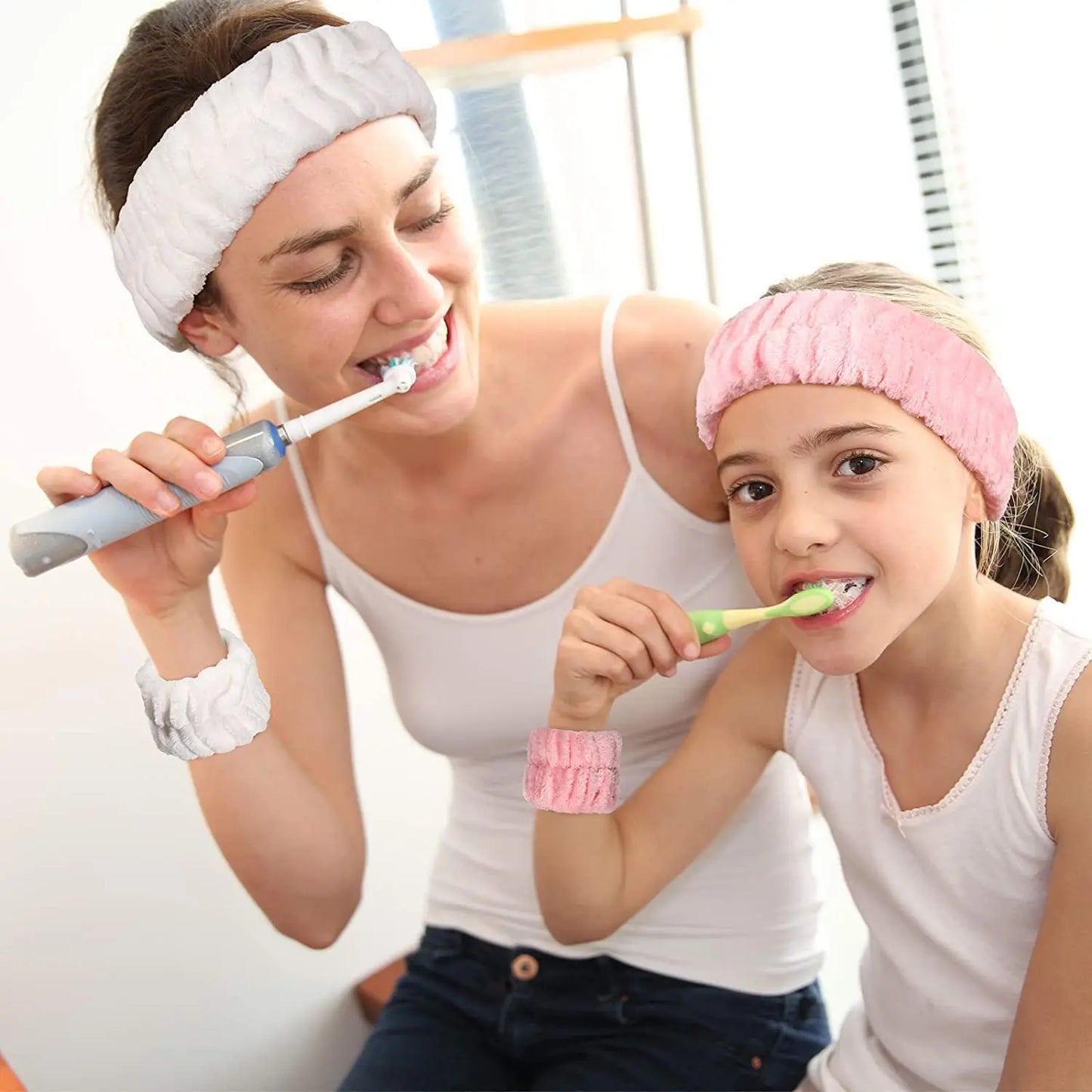 mother and daughter wearing white and pink head and wristbands